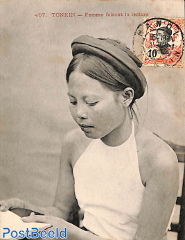 Postcard reading woman with stamp on frontside (not sent)